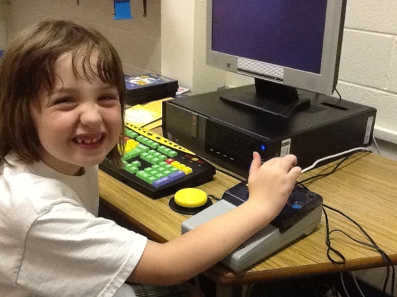girl at computer smiling